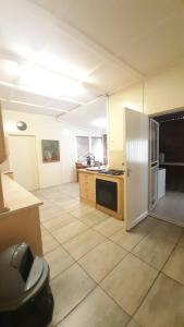 a kitchen with a white refrigerator in a room at Alhoa 1 in Gariep Dam +8 photos