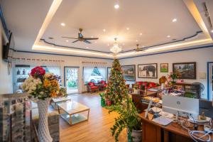 a store with a christmas tree in the middle of a room at Rinrada Resort in Ban Mae Mae