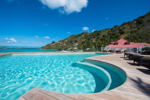 a swimming pool with a view of the ocean at Grand Case Beach Club in Grand Case