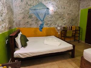 Postel nebo postele na pokoji v ubytování Sigiriya Vee Guest