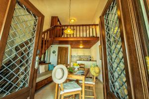 a kitchen with a table and a dining room at Pounda Paou in Metókhion