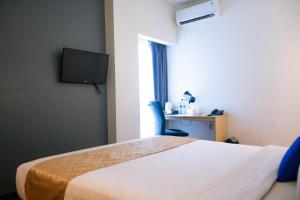 Voodi või voodid majutusasutuse Yunna Hotel Lampung toas