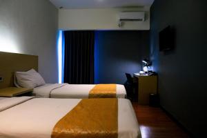 Voodi või voodid majutusasutuse Yunna Hotel Lampung toas