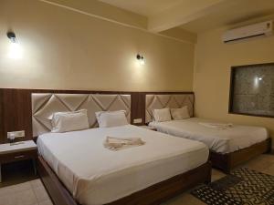 Voodi või voodid majutusasutuse Ricardo Beach Resort toas