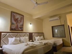 Voodi või voodid majutusasutuse Ricardo Beach Resort toas