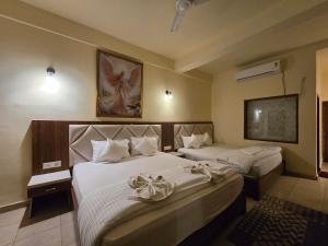 Voodi või voodid majutusasutuse Ricardo Beach Resort toas