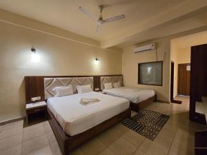 Voodi või voodid majutusasutuse Ricardo Beach Resort toas