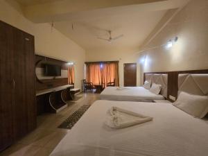 Voodi või voodid majutusasutuse Ricardo Beach Resort toas