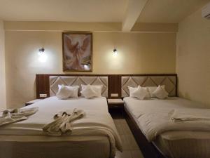 Voodi või voodid majutusasutuse Ricardo Beach Resort toas
