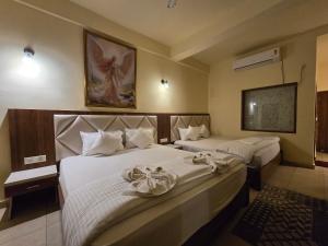 Voodi või voodid majutusasutuse Ricardo Beach Resort toas