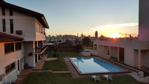 a view of a swimming pool on the roof of a building at Maitá Palace Hotel in Passo Fundo