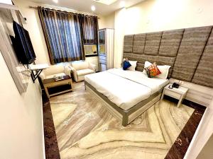 Postel nebo postele na pokoji v ubytování Hotel Amrit Villa