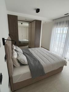 a bedroom with a large bed with a mirror at Theview 1 in Maslenica +44 photos