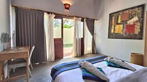 Postel nebo postele na pokoji v ubytování Kies Villas Lombok