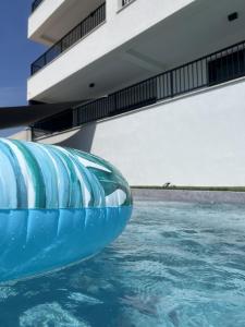 an inflatable pool in a building with water at Theview 1 in Maslenica