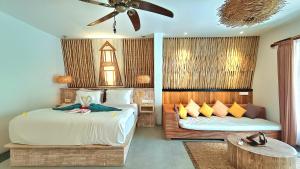 Postel nebo postele na pokoji v ubytování Kies Villas Lombok + 37 fotografií