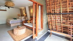 Postel nebo postele na pokoji v ubytování Kies Villas Lombok