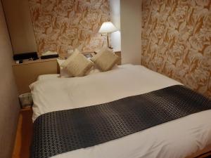 Postel nebo postele na pokoji v ubytování Hotel Moana Otsuka (Adult Only)