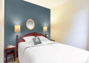 Ein Bett oder Betten in einem Zimmer der Unterkunft Résidence Pierre & Vacances Le Domaine de Gascogne