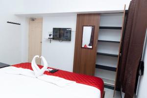 Ένα ή περισσότερα κρεβάτια σε δωμάτιο στο ASK Grande Residecy +5 φωτογραφίες