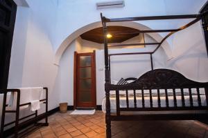 Ένα ή περισσότερα κρεβάτια σε δωμάτιο στο Villa 1908 Hikkaduwa