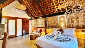 Postel nebo postele na pokoji v ubytování Kies Villas Lombok