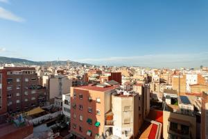 a view of a city with buildings at Camp nou Apartamento in Hospitalet de Llobregat