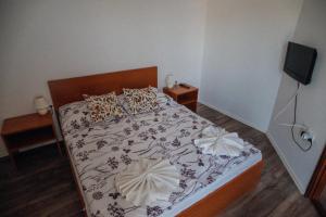 Posteľ alebo postele v izbe v ubytovaní Megnyugtat-lak Apartmanház