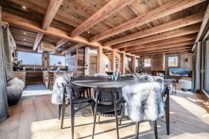 a dining room with a table and chairs at Chalet Betula, Saint-Gervais - by EMERALD STAY in Saint-Gervais-les-Bains