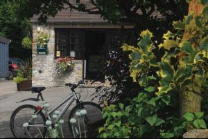 a bike parked in front of a house at Horton's Hideaway at Ashbourne Heights Holiday Park in Ashbourne