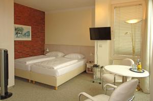 Postel nebo postele na pokoji v ubytování Hotel St.-Michaels-Heim