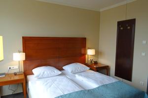 Postel nebo postele na pokoji v ubytování Hotel St.-Michaels-Heim