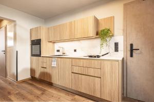 Kuchyň nebo kuchyňský kout v ubytování Studio 24 by Hotel Brücke