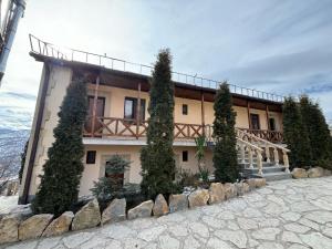 a house with trees in front of it at Lastiver Resort in Yenokavan