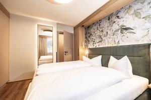 Postel nebo postele na pokoji v ubytování Studio 24 by Hotel Brücke
