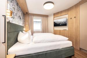 Postel nebo postele na pokoji v ubytování Studio 24 by Hotel Brücke