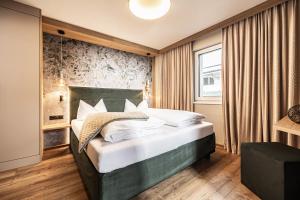 Postel nebo postele na pokoji v ubytování Studio 24 by Hotel Brücke