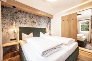 Postel nebo postele na pokoji v ubytování Studio 24 by Hotel Brücke