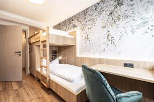 Postel nebo postele na pokoji v ubytování Studio 24 by Hotel Brücke