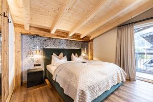Postel nebo postele na pokoji v ubytování Studio 24 by Hotel Brücke
