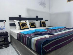 Ένα ή περισσότερα κρεβάτια σε δωμάτιο στο Yashi's Place Sigiriya