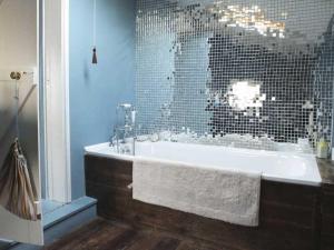 a bathroom with a bath tub with a glass shower at Stanhope House in Hastings +10 photos