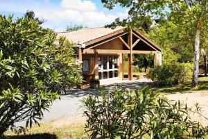 a small house with a porch at Camping Onlycamp de Boucocers in Lagrasse