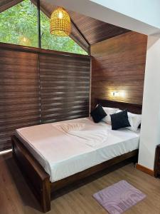 Postel nebo postele na pokoji v ubytování Singhagiri Haven Sigiriya