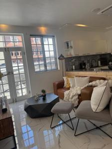 a living room with a couch and a table at Luxurious Apartment in Cape Town