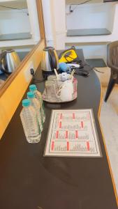 a table with a game on it with water bottles at KDM Hotel Indore Palace- a walk away from Saibaba Temple in Shirdi