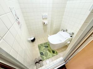Koupelna v ubytování PetitHotel017全室ミニキッチン付きファミリルーム 飲食街中心 阿波踊り会館7分 文理 徳島大学 アスティとくしま車8分