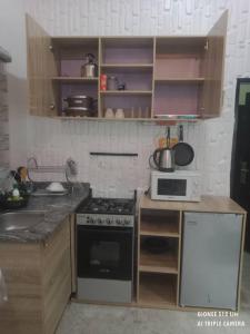 Una cocina o cocineta en Cozybay Apartments