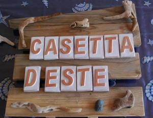 a cake with the words caserta desire written on it at Casetta D'Este in Palmadula