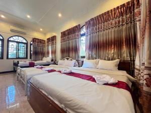 Postel nebo postele na pokoji v ubytování Lotus Blanc Homestay Villa
